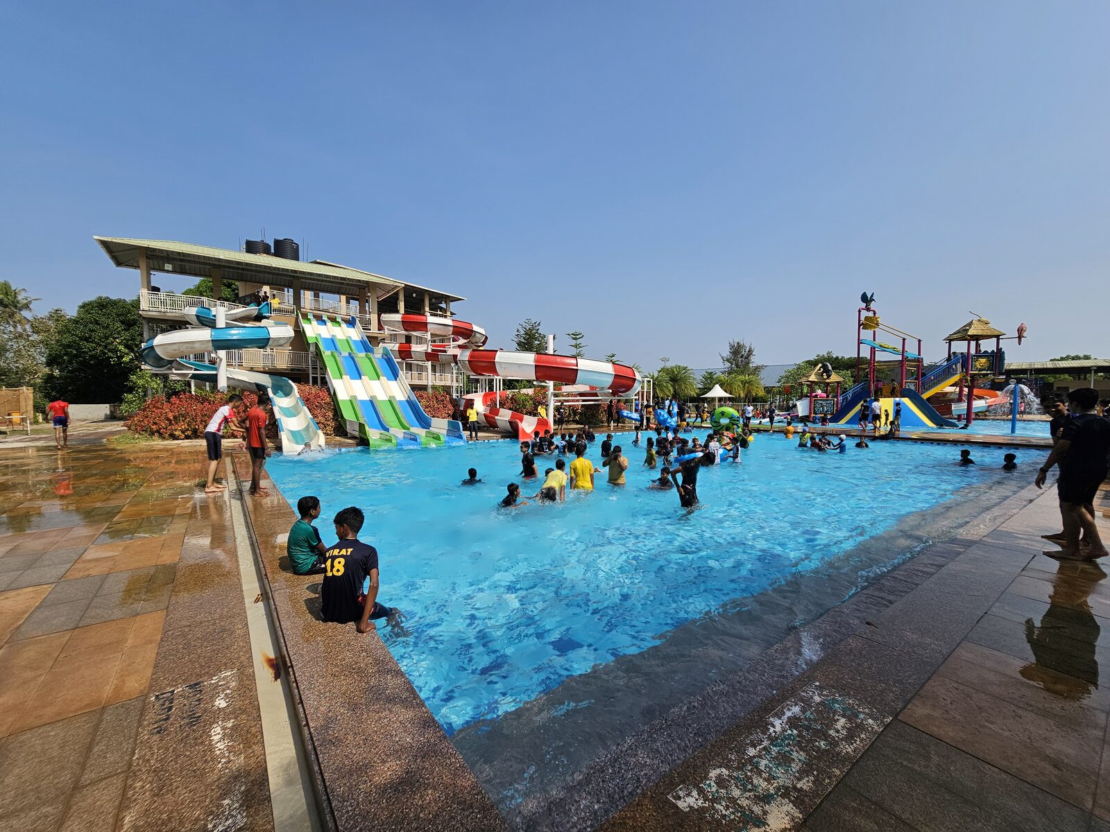 Students playing in the wave pool